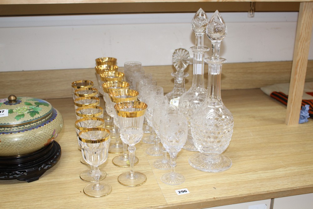 A pair of Stuart? cut glass decanters and stoppers, another decanter, a set of eight vineous etched wine glasses and a set of six Itali